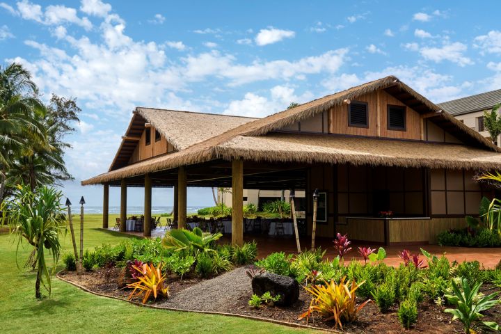 a house with bushes in front of a building