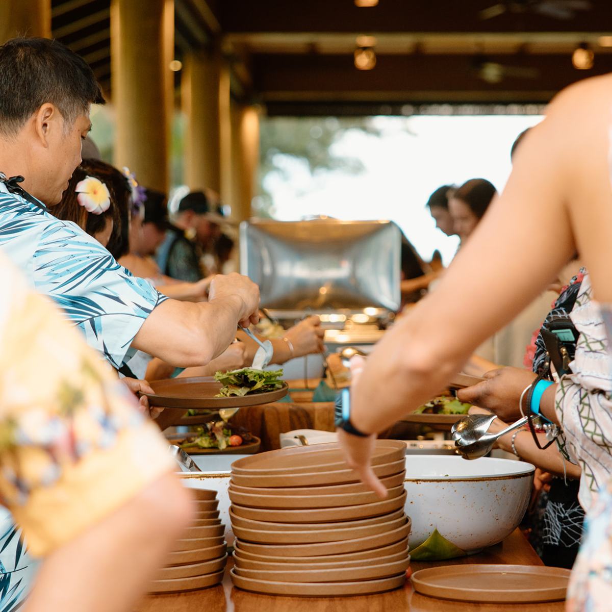 a group of people preparing food in a kitchen